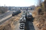 NS 6992 leads a train out of Enola yard, past 12R which awaits clearance